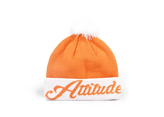 orange and white pom pom beanie